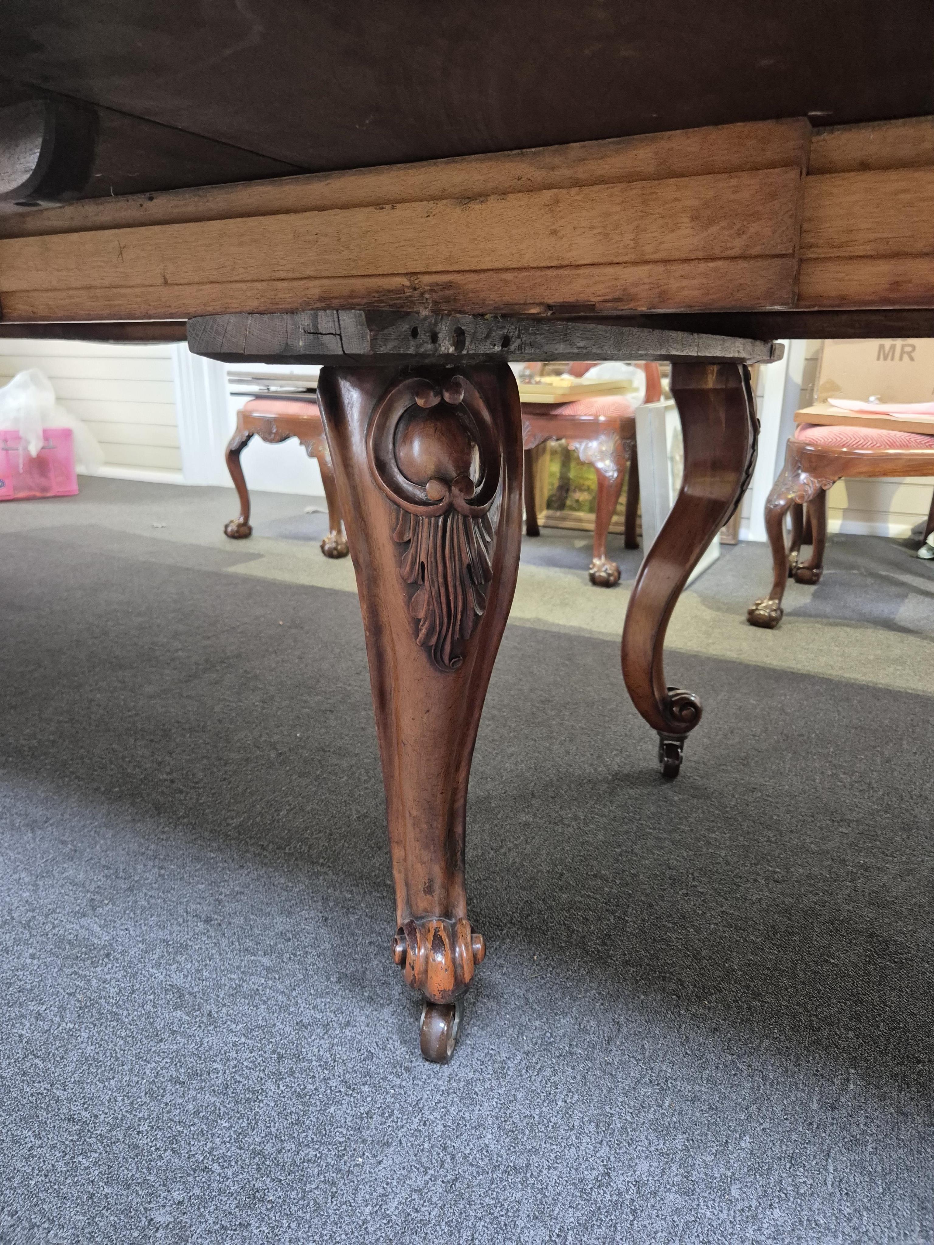 An unusually large William IV mahogany extending dining table